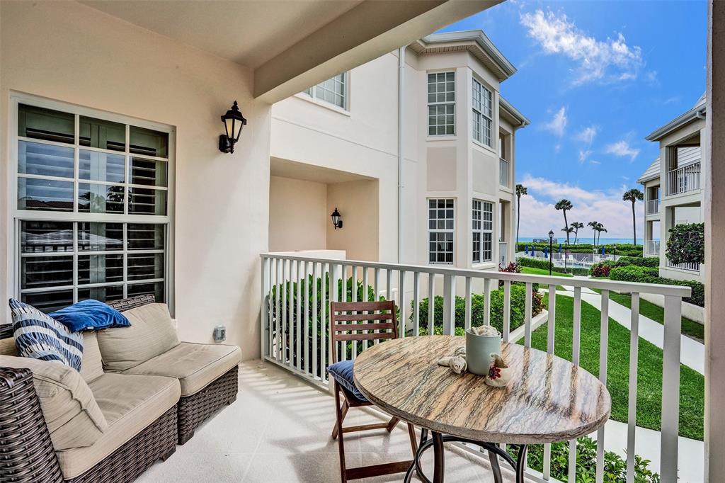 5900 Old Ocean Boulevard, Unit A9 Ocean Ridge, FL 33435 - Photo 22 of 29 a view of a chair and tables front of the house
