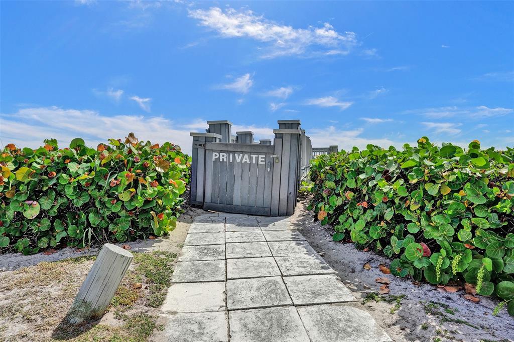 5900 Old Ocean Boulevard, Unit A9 Ocean Ridge, FL 33435 - Photo 27 of 29 a view of a garden with wooden fence