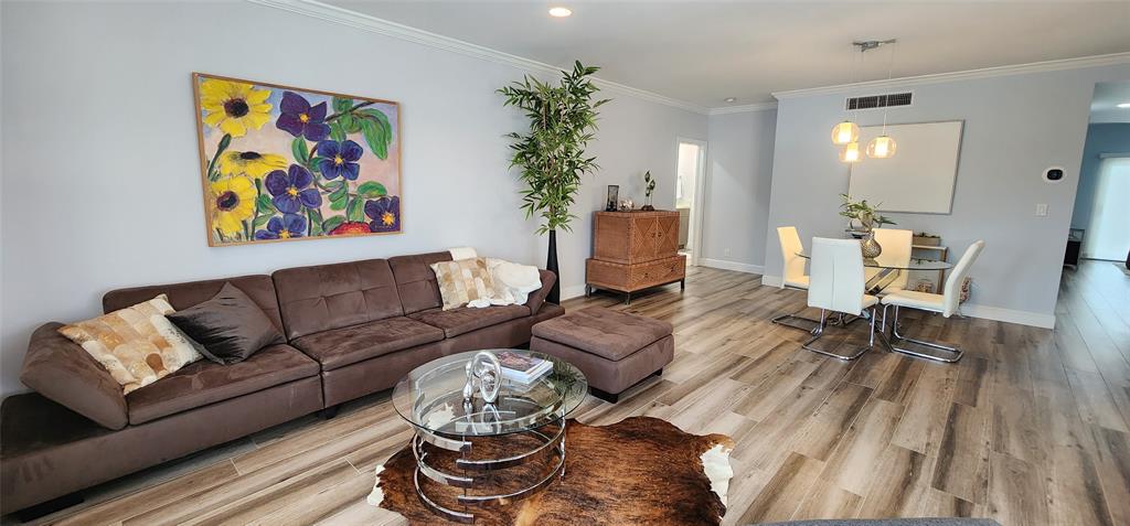 5900 Old Ocean Boulevard, Unit A9 Ocean Ridge, FL 33435 - Photo 7 of 29 a living room with furniture and wooden floor