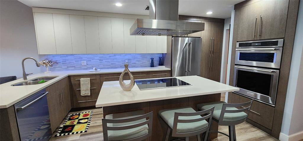 5900 Old Ocean Boulevard, Unit A9 Ocean Ridge, FL 33435 - Photo 10 of 29 a kitchen with stainless steel appliances a sink and a refrigerator