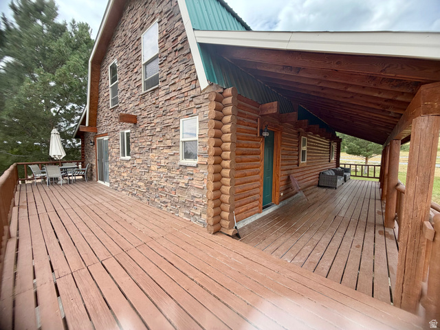 358 Maple Drive Fish Haven, ID 83287 - Photo 3 of 21 Expansive outdoor decking features a blend of log siding and stone veneer construction