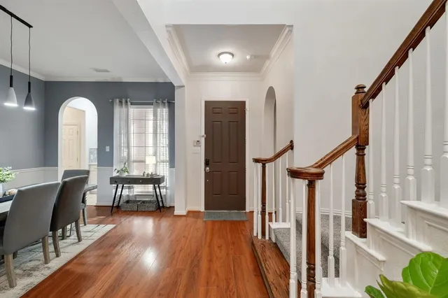 a view of a livingroom with furniture and hardwood floor