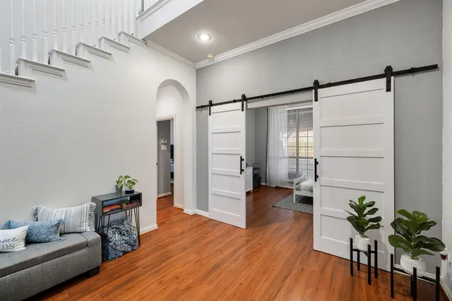 a livingroom with furniture and wooden floor