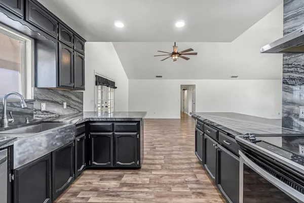 a kitchen with a stove and a sink