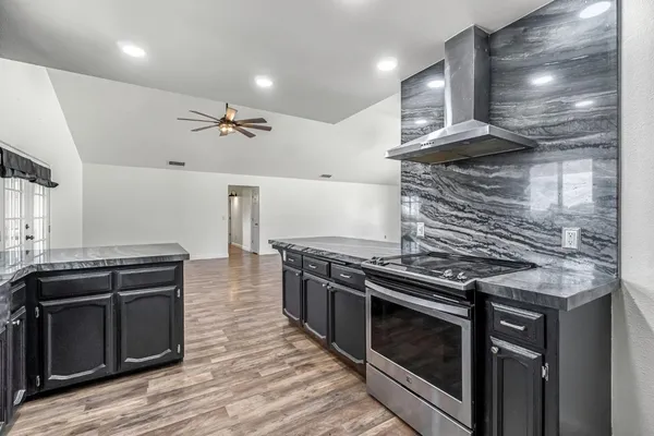 a kitchen with a stove and a microwave
