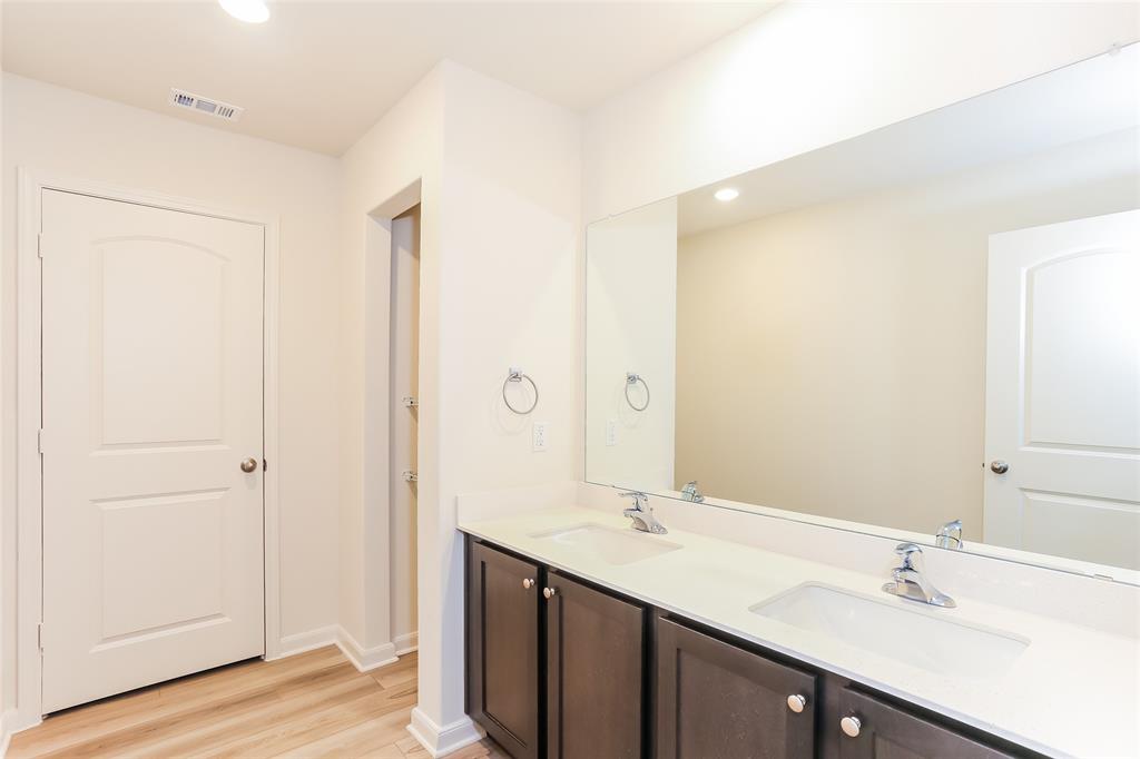 140 Switchback Hl Road Newark, TX 76071 - Photo 4 of 17 a bathroom with a double vanity sink mirror and