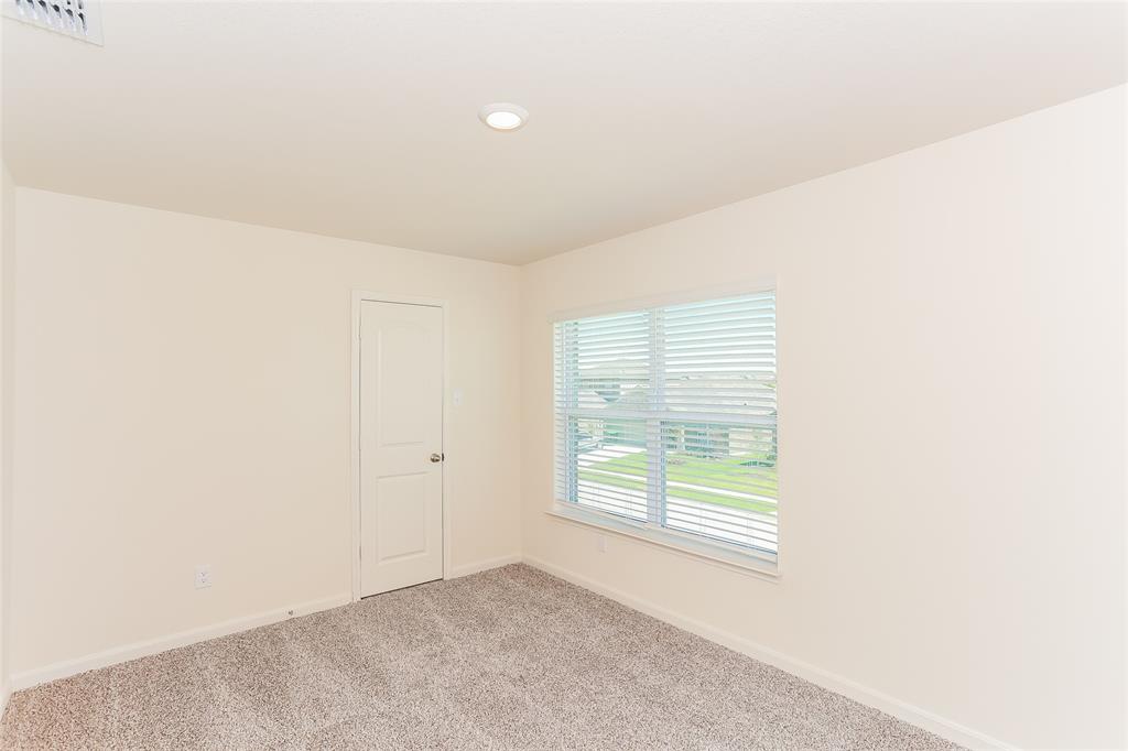 140 Switchback Hl Road Newark, TX 76071 - Photo 7 of 17 a view of an empty room with a window