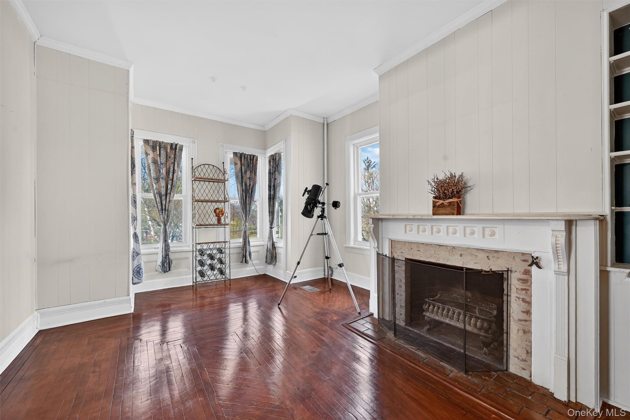 12 Perry Creek Road Washingtonville, NY 10992 - Photo 16 of 48 a view of an empty room with wooden floor fireplace and a window