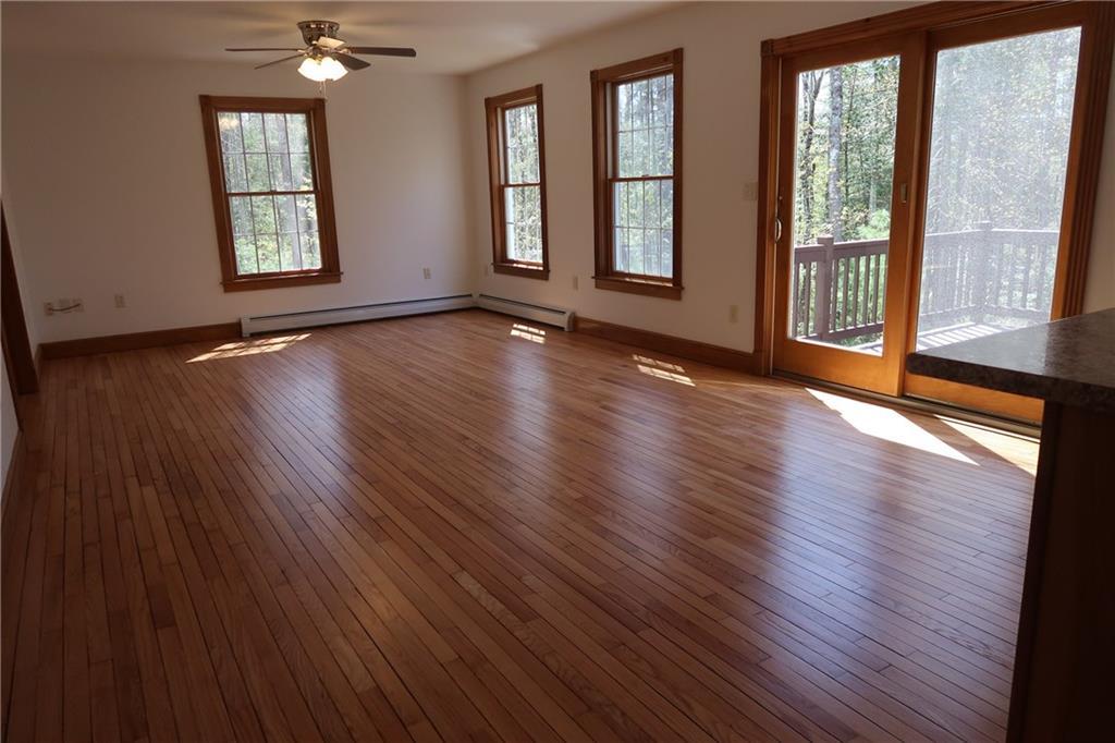 6 Pheasant Run Road Belgrade, ME 04917 - Photo 19 of 35 Large living room with pretty HW...