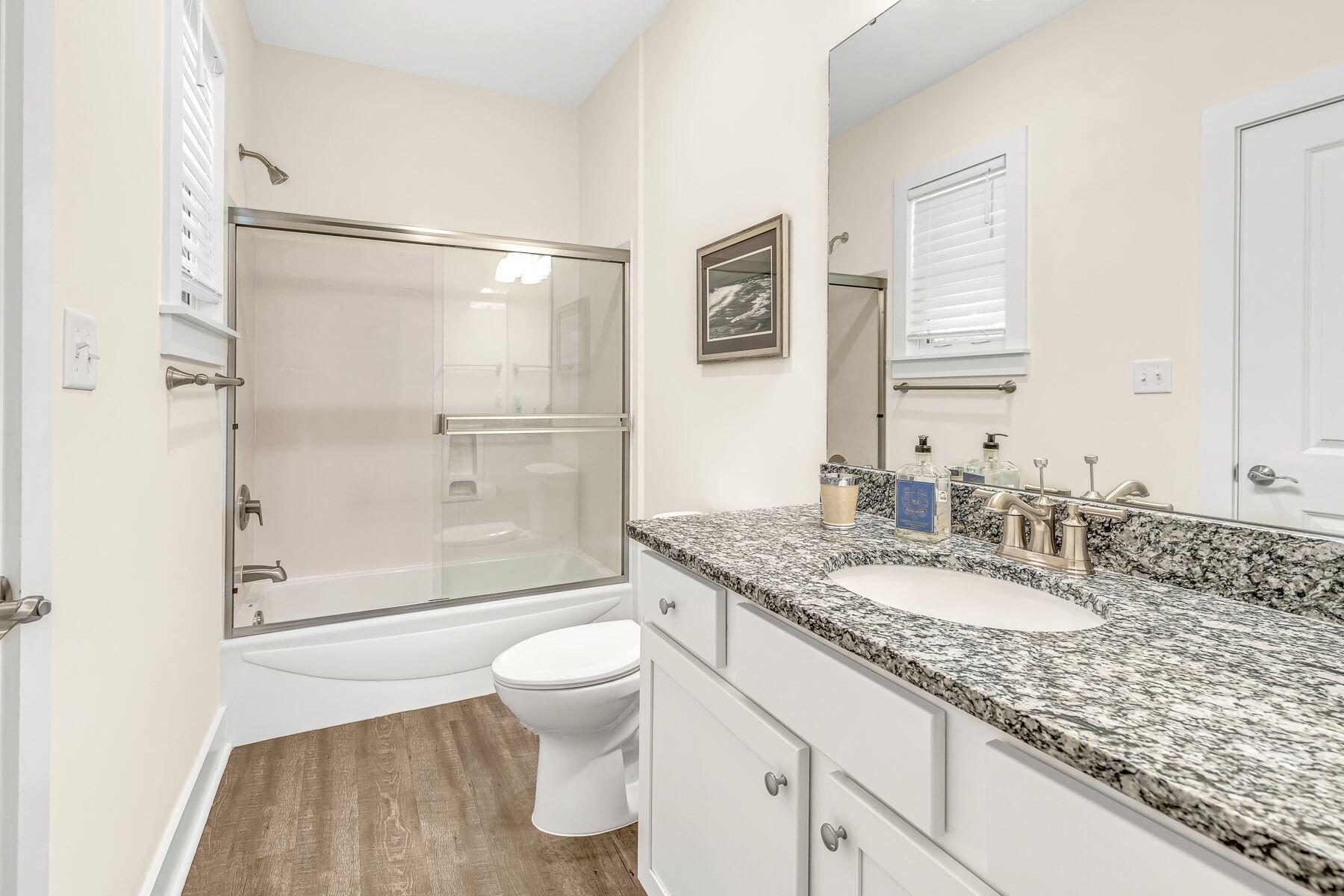 4000 West County Highway 30A, Unit 322 Santa Rosa Beach, FL 32459 - Photo 15 of 30 a bathroom with a granite countertop sink toilet and shower