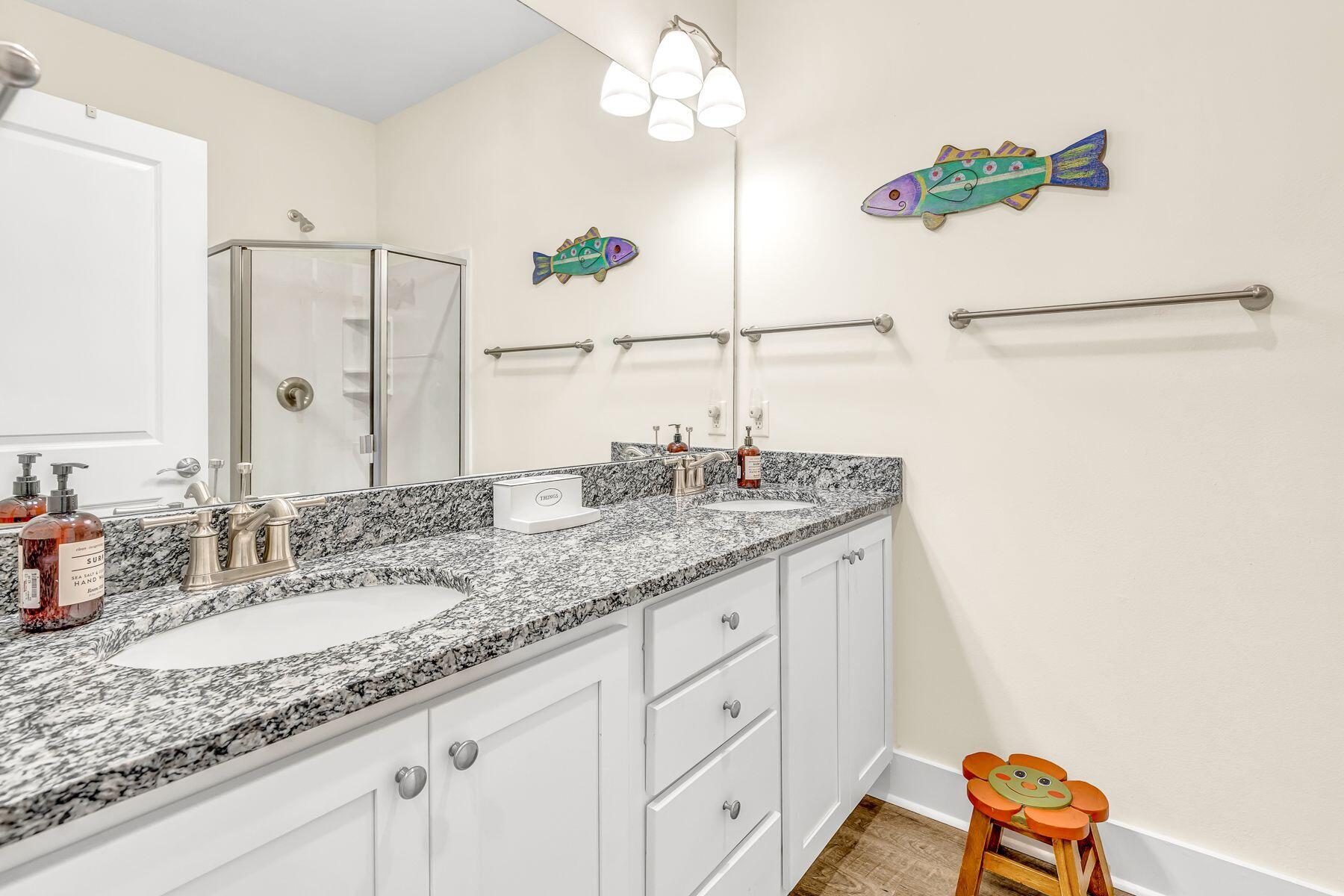 4000 West County Highway 30A, Unit 322 Santa Rosa Beach, FL 32459 - Photo 17 of 30 a bathroom with a granite countertop sink and a mirror