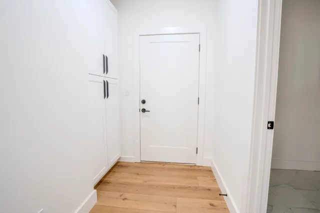 a view of a room with furniture and a wooden floor