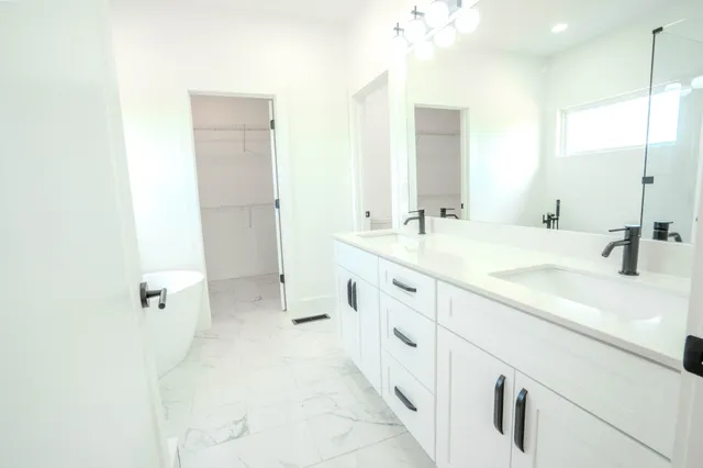 a bathroom with a toilet and a bathtub