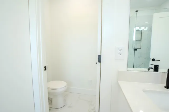 a big house with a big yard and large trees