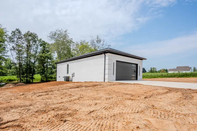 a backyard of a house with large trees