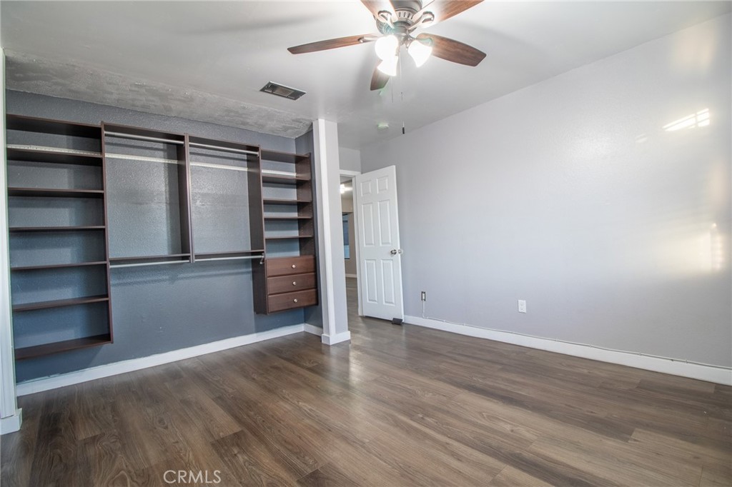 3112 Lynae Way Hemet, CA 92545 - Photo 15 of 26 a view of an empty room with a window and wooden floor
