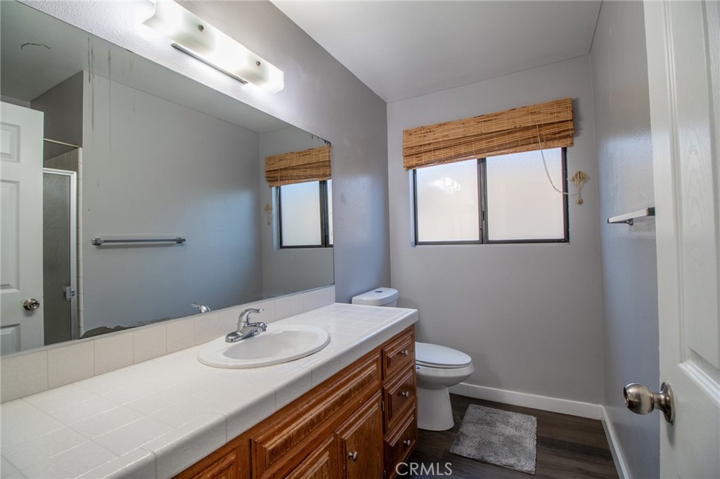 3112 Lynae Way Hemet, CA 92545 - Photo 16 of 26 a bathroom with a sink a toilet and mirror