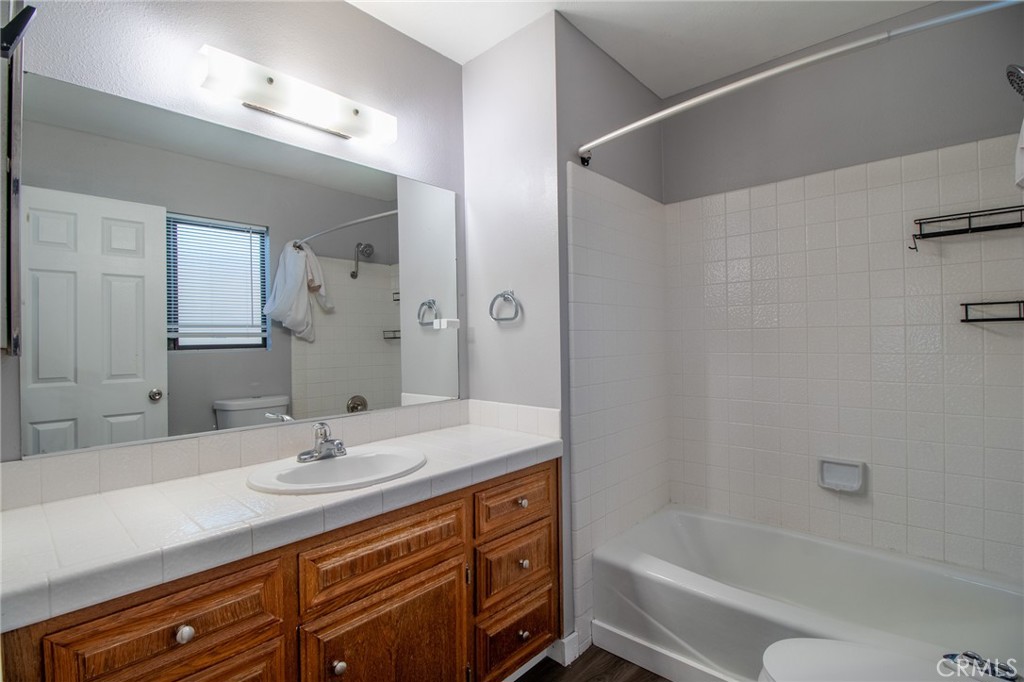 3112 Lynae Way Hemet, CA 92545 - Photo 20 of 26 a bathroom with a sink double vanity granite tub shower and a mirror