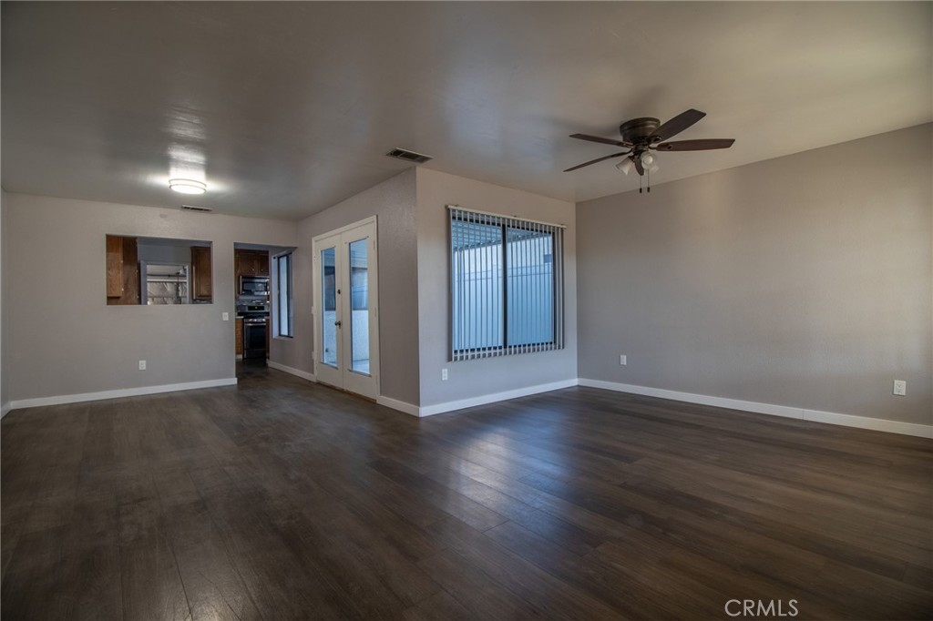 3112 Lynae Way Hemet, CA 92545 - Photo 5 of 26 a view of empty room with wooden floor and fan
