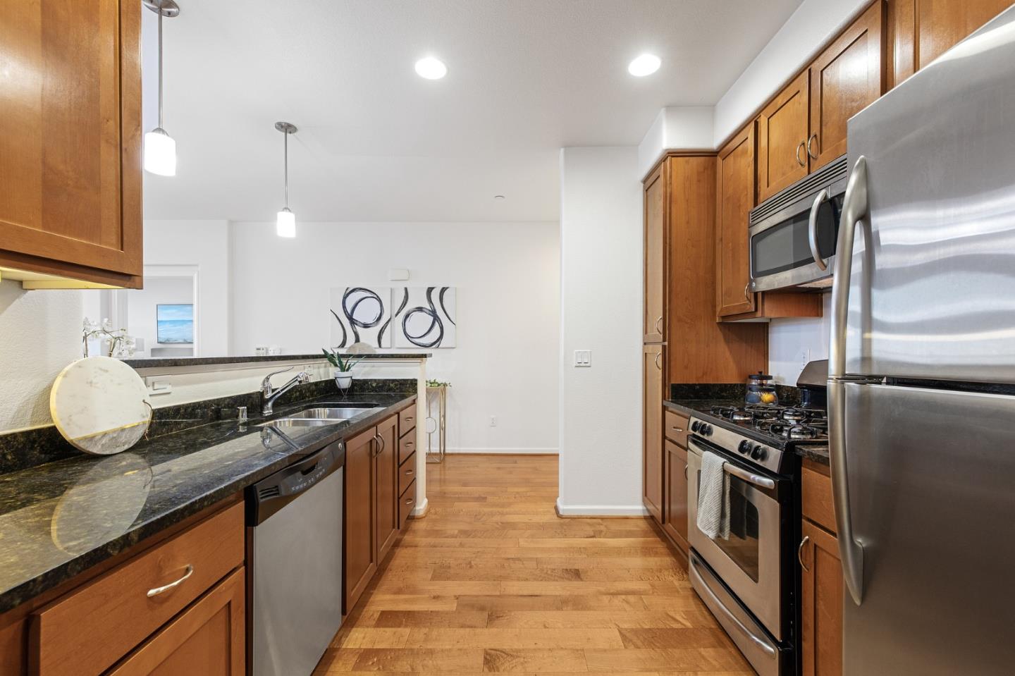 1388 Broadway, Unit 477 Millbrae, CA 94030 - Photo 13 of 33 a kitchen with a stove and a refrigerator