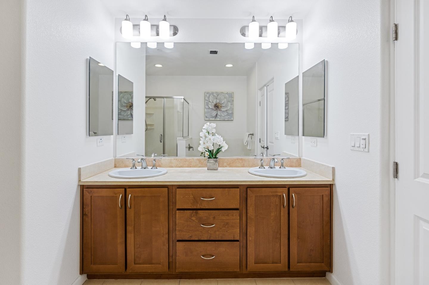 1388 Broadway, Unit 477 Millbrae, CA 94030 - Photo 17 of 33 a bathroom with a double vanity sink and a mirror