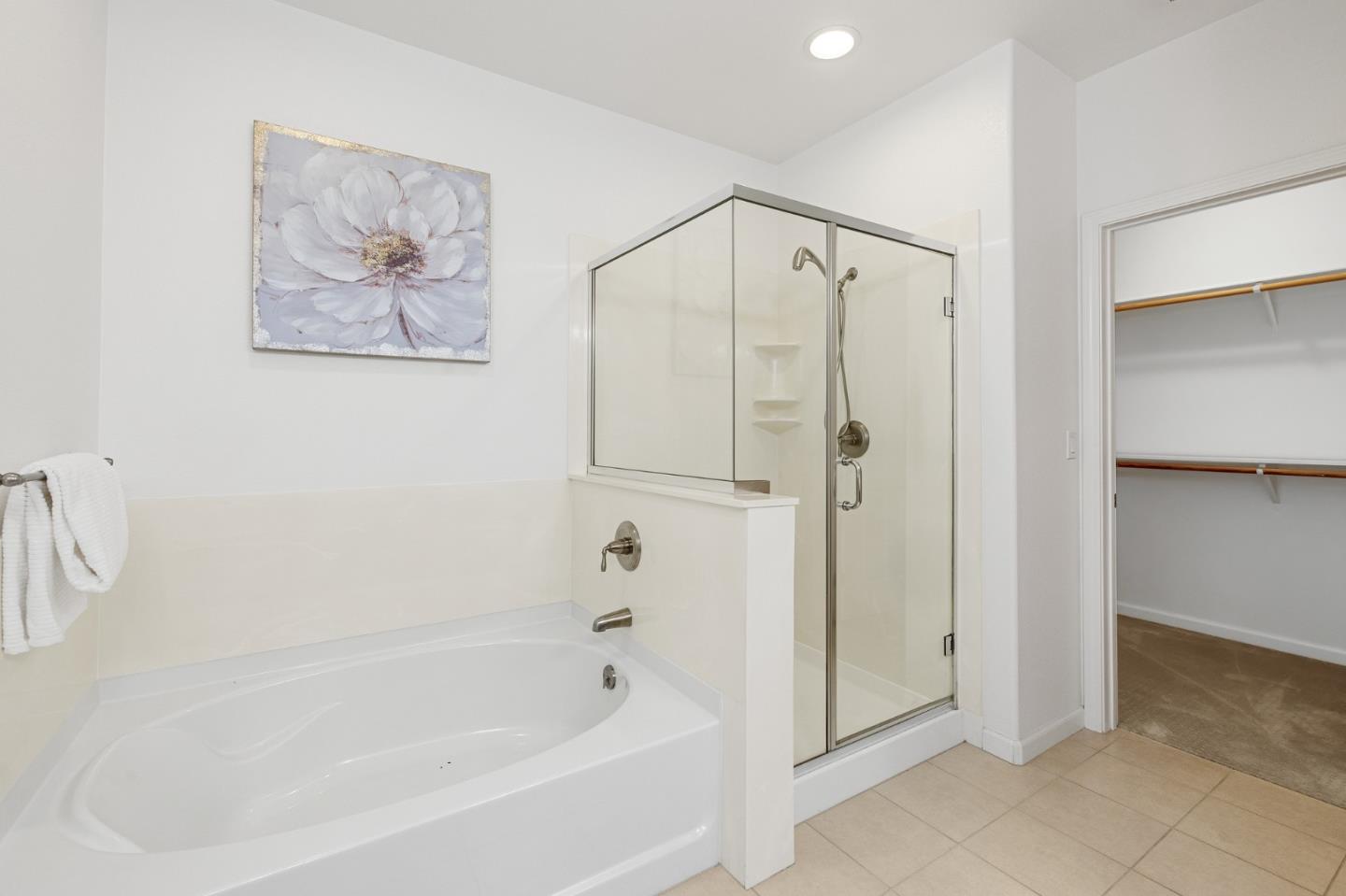 1388 Broadway, Unit 477 Millbrae, CA 94030 - Photo 18 of 33 a bathroom with a bathtub and a shower
