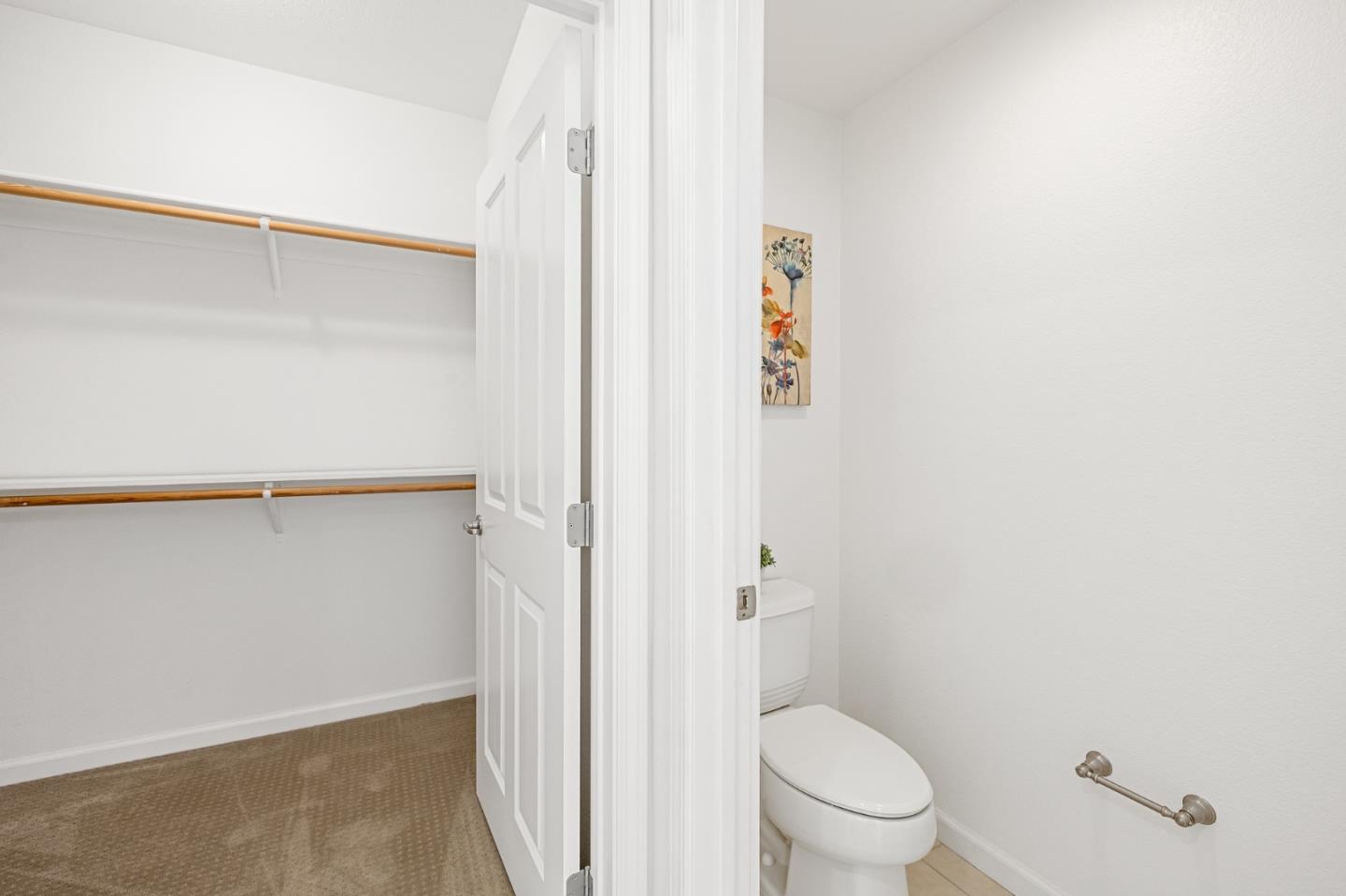 1388 Broadway, Unit 477 Millbrae, CA 94030 - Photo 19 of 33 a bathroom with a granite countertop toilet and a shower