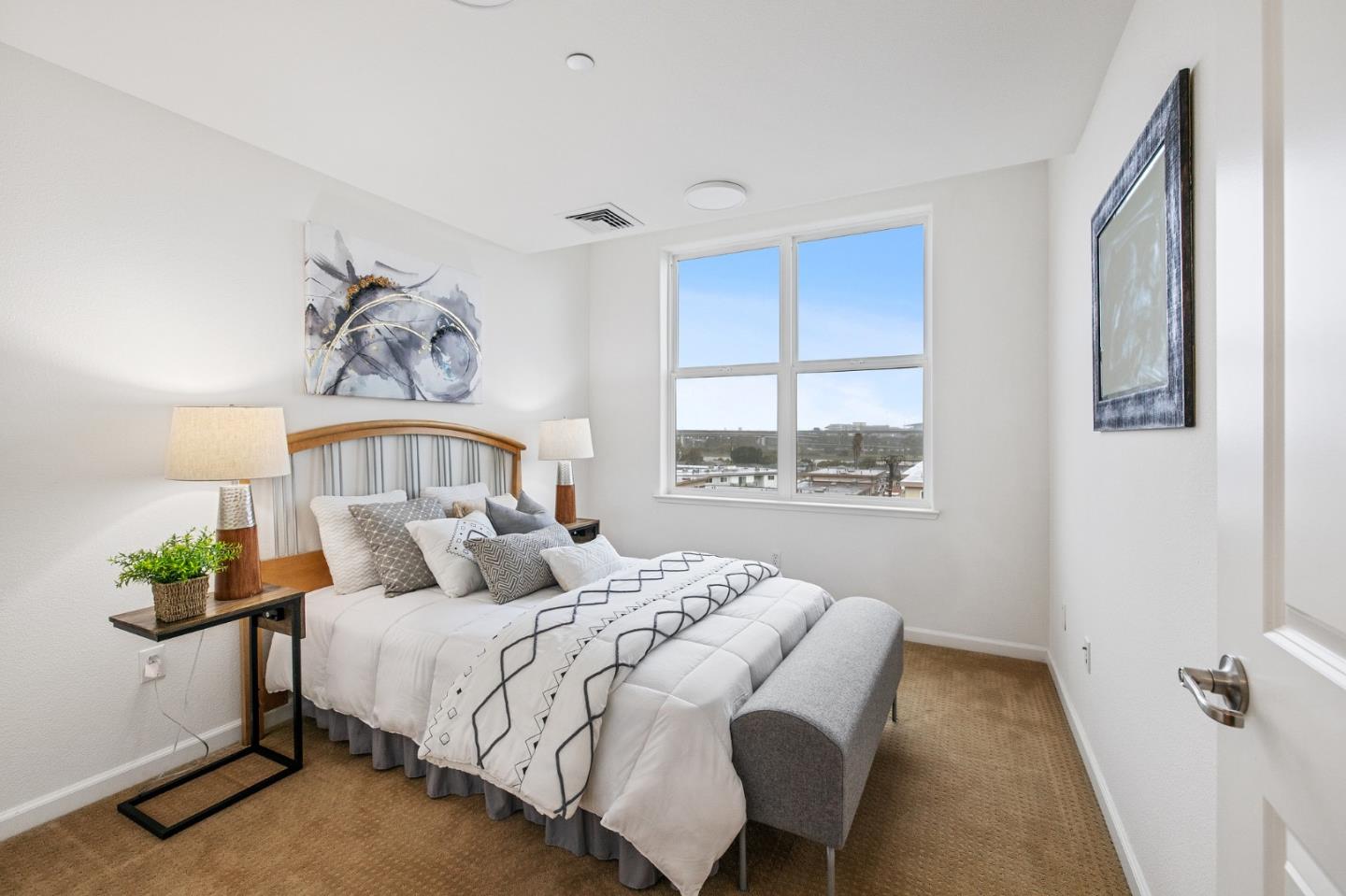 1388 Broadway, Unit 477 Millbrae, CA 94030 - Photo 21 of 33 a bedroom with a large bed and a window