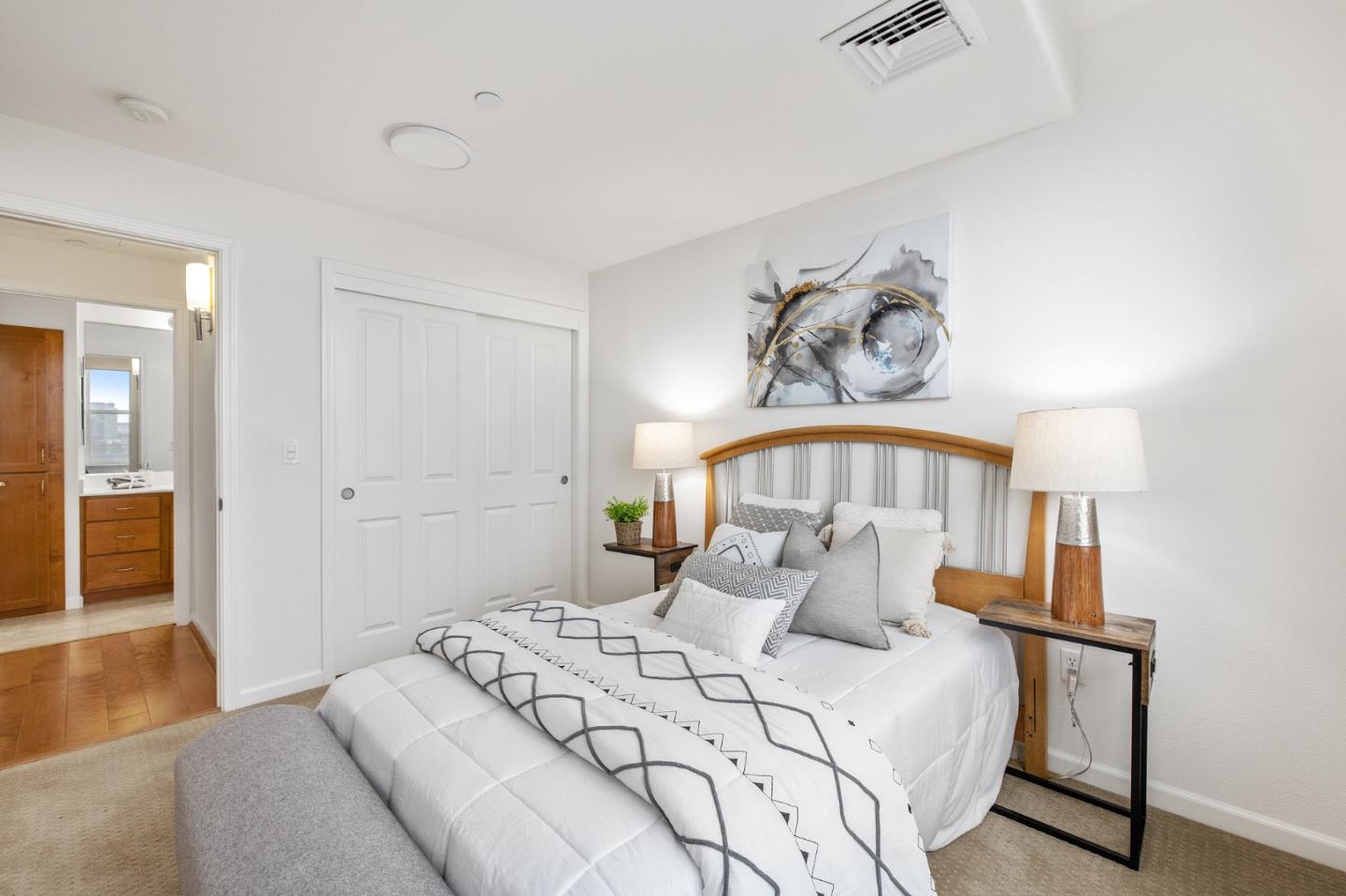 1388 Broadway, Unit 477 Millbrae, CA 94030 - Photo 22 of 33 a bedroom with a bed and a chandelier