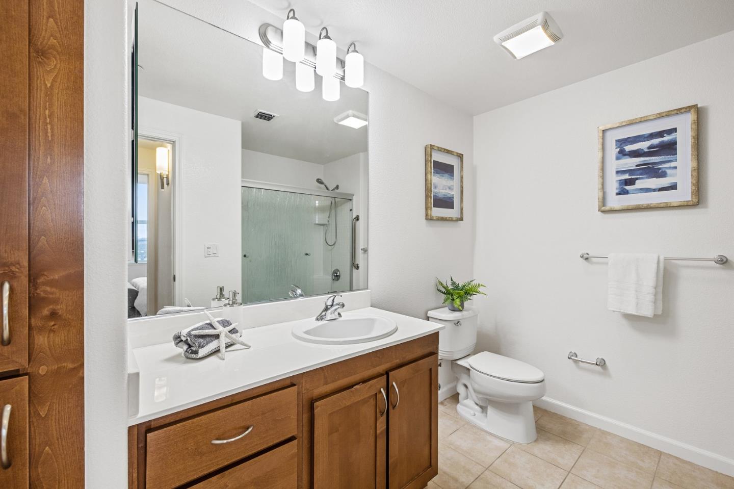 1388 Broadway, Unit 477 Millbrae, CA 94030 - Photo 23 of 33 a bathroom with a sink a toilet and shower