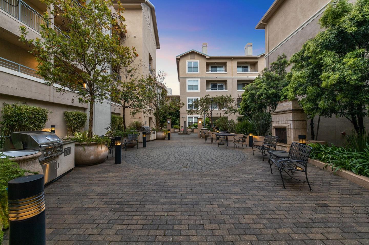 1388 Broadway, Unit 477 Millbrae, CA 94030 - Photo 31 of 33 a view of a patio with couches table and chairs and potted plants