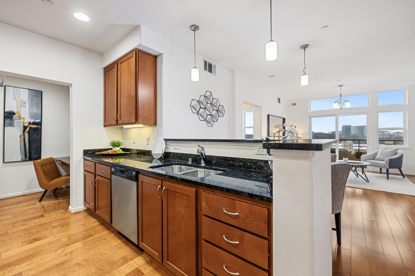 1388 Broadway, Unit 477 Millbrae, CA 94030 - Photo 10 of 33 a kitchen with stainless steel appliances granite countertop a stove a sink and a refrigerator