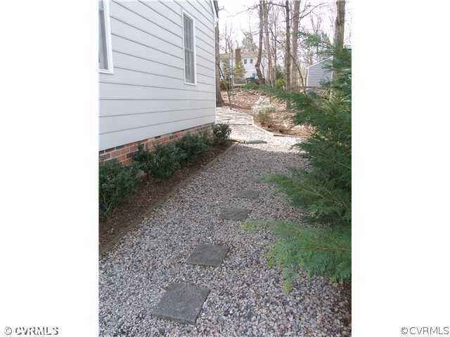 12901 Ashtree Road Midlothian, VA 23114 - Photo 23 of 24 a view of a backyard with pathway
