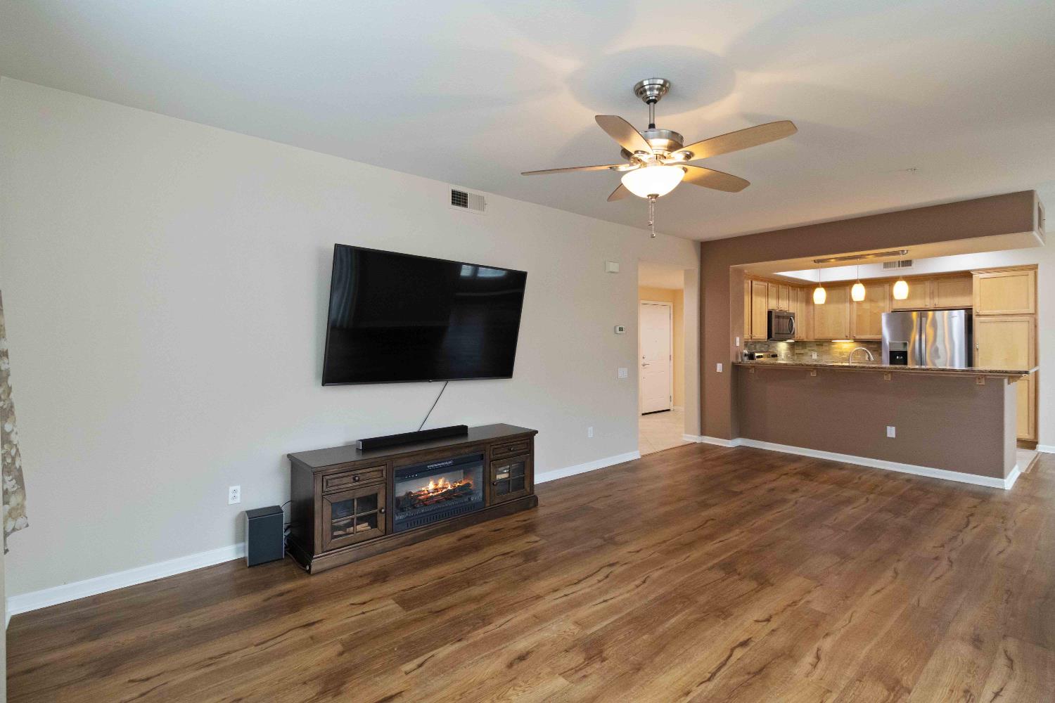 1550 Topanga Lane, Unit 101 Lincoln, CA 95648 - Photo 11 of 27 a living room with furniture and a flat screen tv