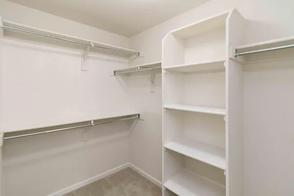 a view of an empty walk in closet