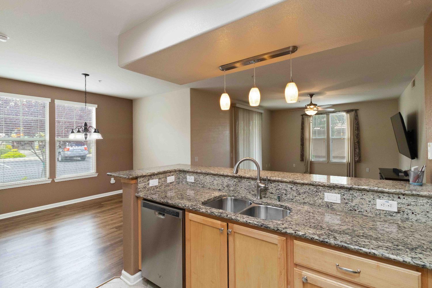 1550 Topanga Lane, Unit 101 Lincoln, CA 95648 - Photo 10 of 27 a bathroom with a granite countertop sink and a mirror