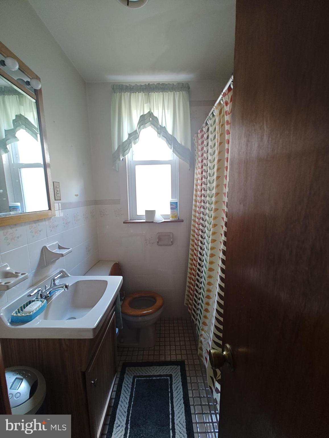3274 Cedar Street Philadelphia, PA 19134 - Photo 13 of 18 a bathroom with a sink toilet and shower