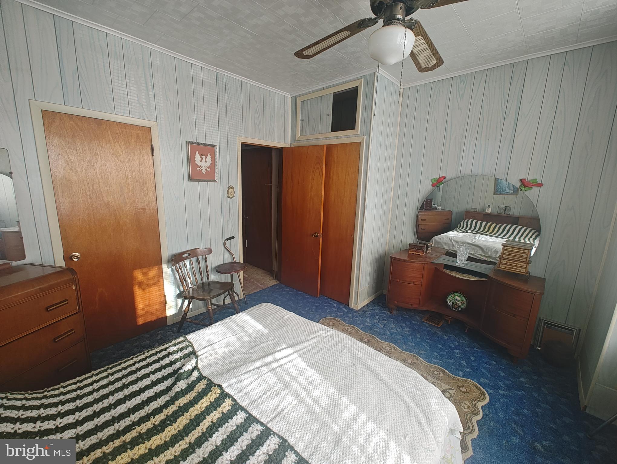 3274 Cedar Street Philadelphia, PA 19134 - Photo 18 of 18 a bedroom with a bed and a dresser