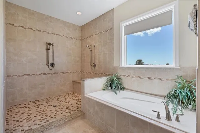 a bathroom with a bathtub and a sink