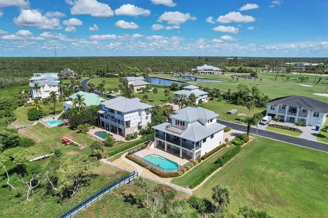 an aerial view of a house with a lake view