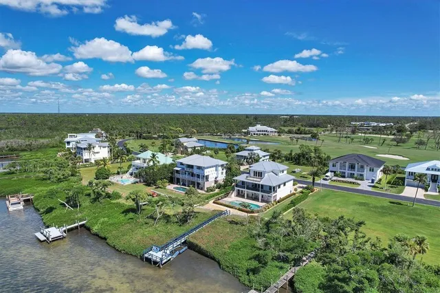 an aerial view of a house and outdoor space
