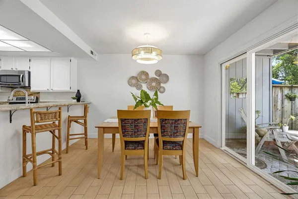a dining room with furniture and window