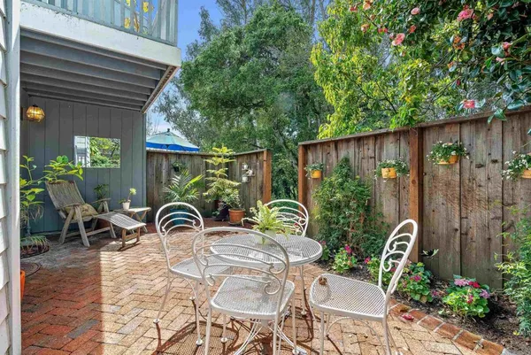a patio with table and chairs