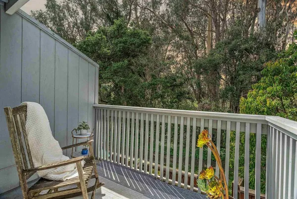 a balcony with wooden floor
