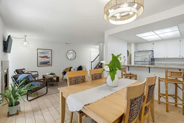 a kitchen with a table and chairs in it