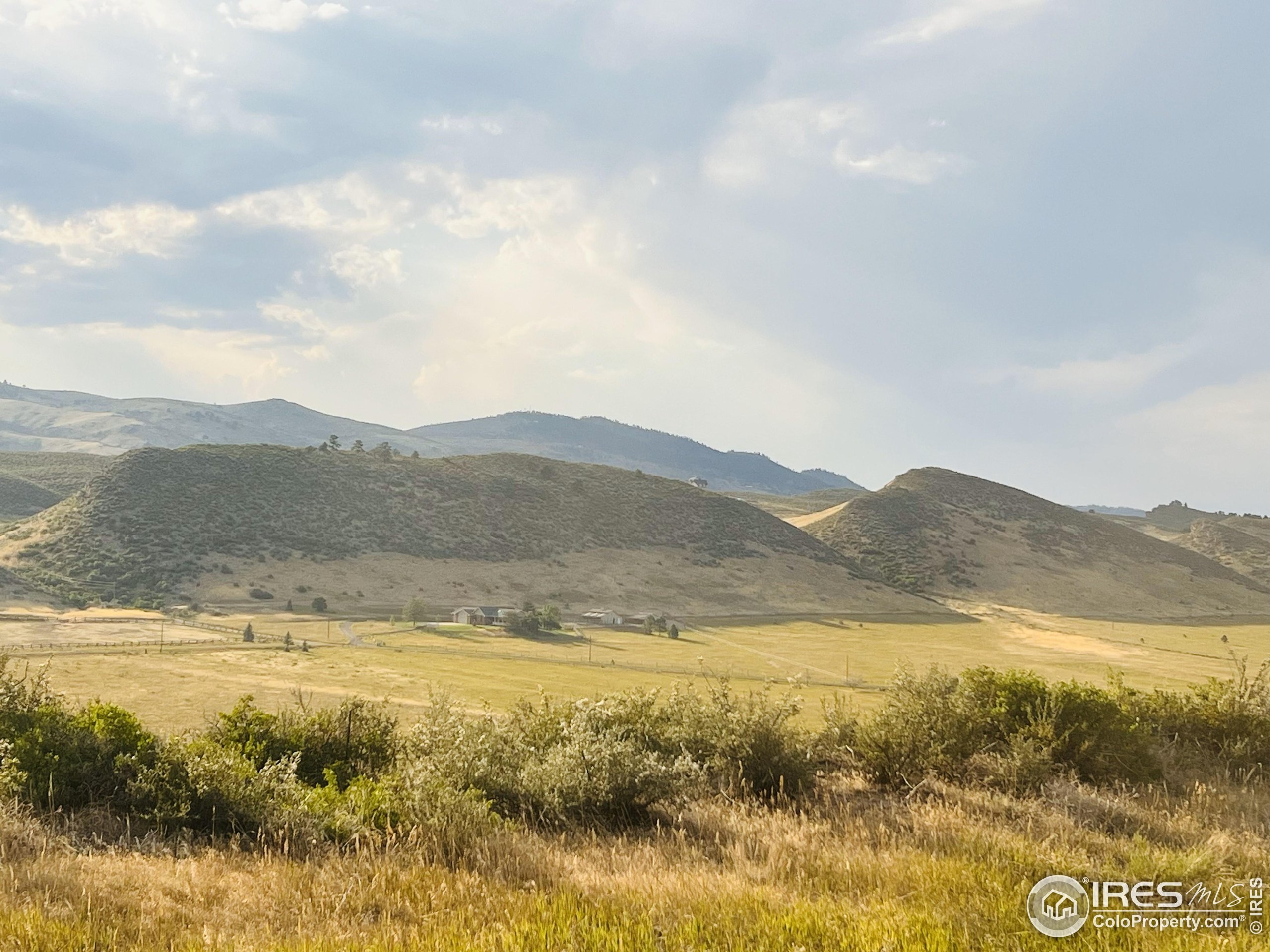 a view of ocean with a mountain