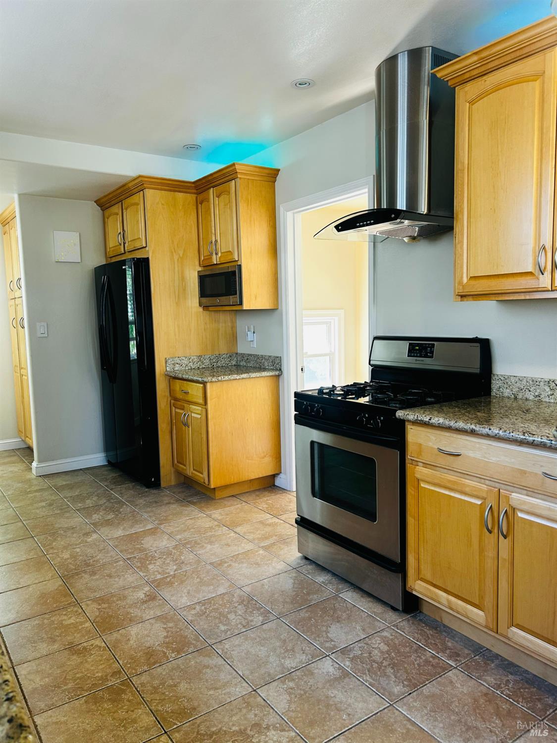 729 First Street Rodeo, CA 94572 - Photo 11 of 35 a kitchen with a stove and a refrigerator