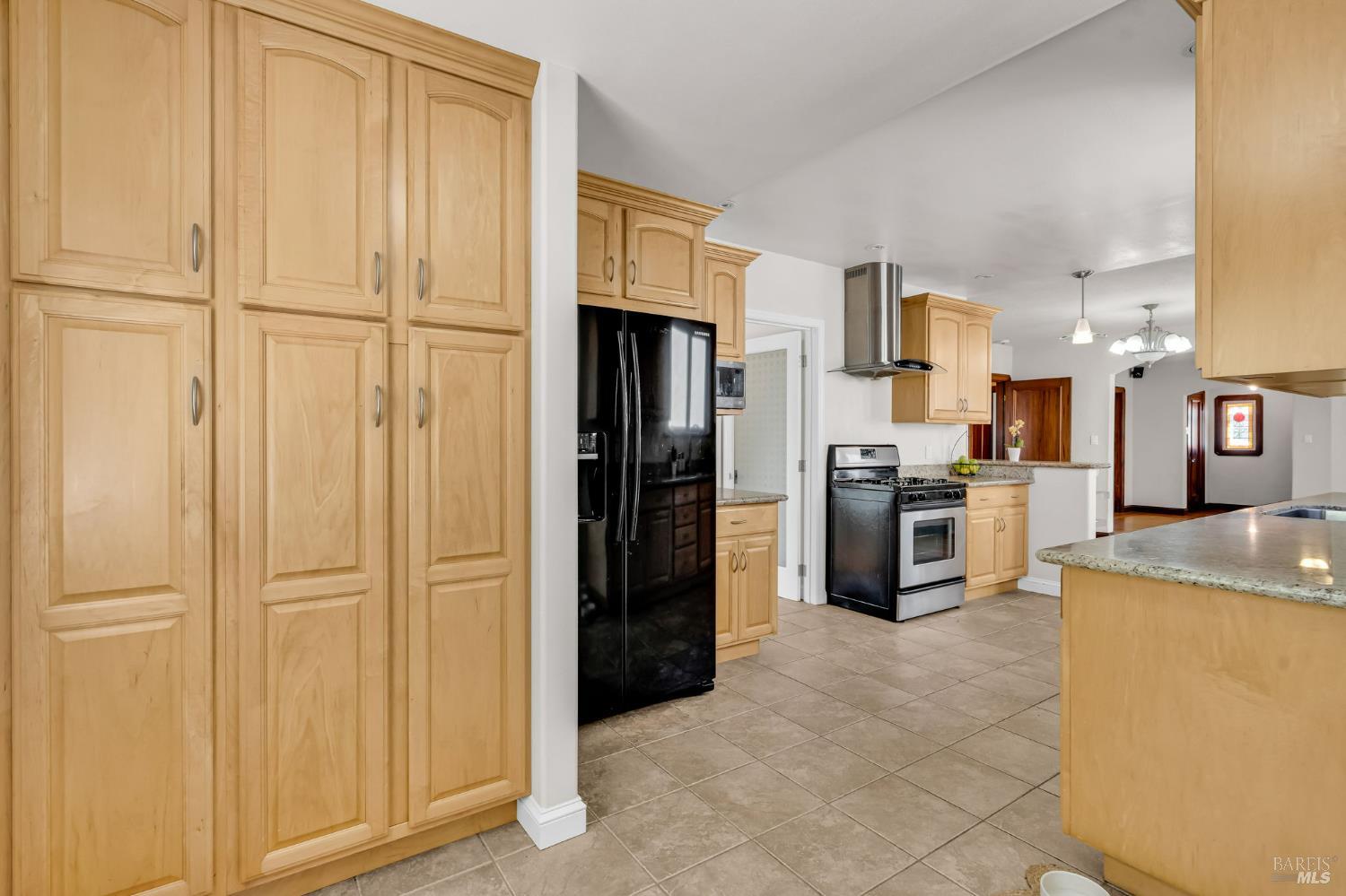 729 First Street Rodeo, CA 94572 - Photo 13 of 35 a kitchen with stainless steel appliances granite countertop a refrigerator a stove and a sink