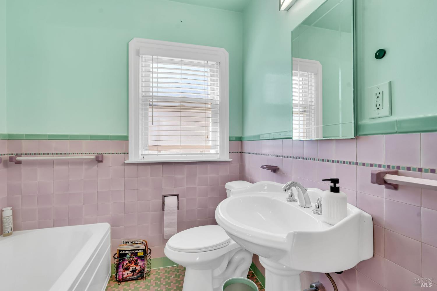 729 First Street Rodeo, CA 94572 - Photo 17 of 35 a bathroom with a sink a toilet and a mirror