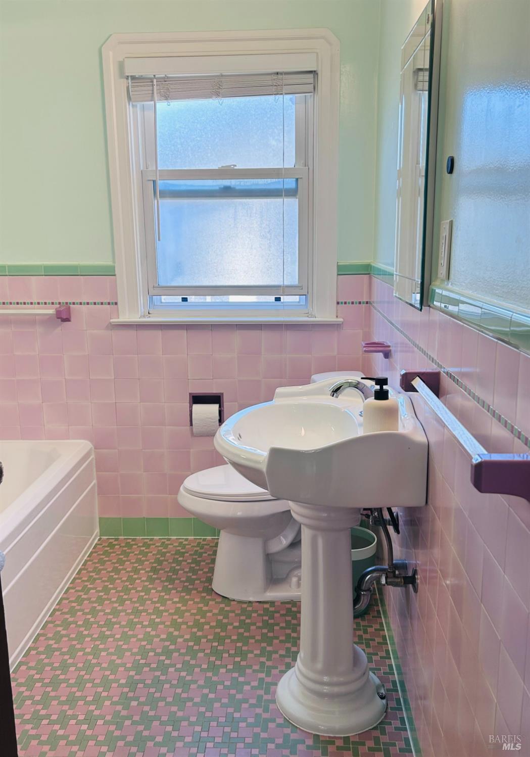 729 First Street Rodeo, CA 94572 - Photo 18 of 35 a bathroom with a sink a toilet and mirror